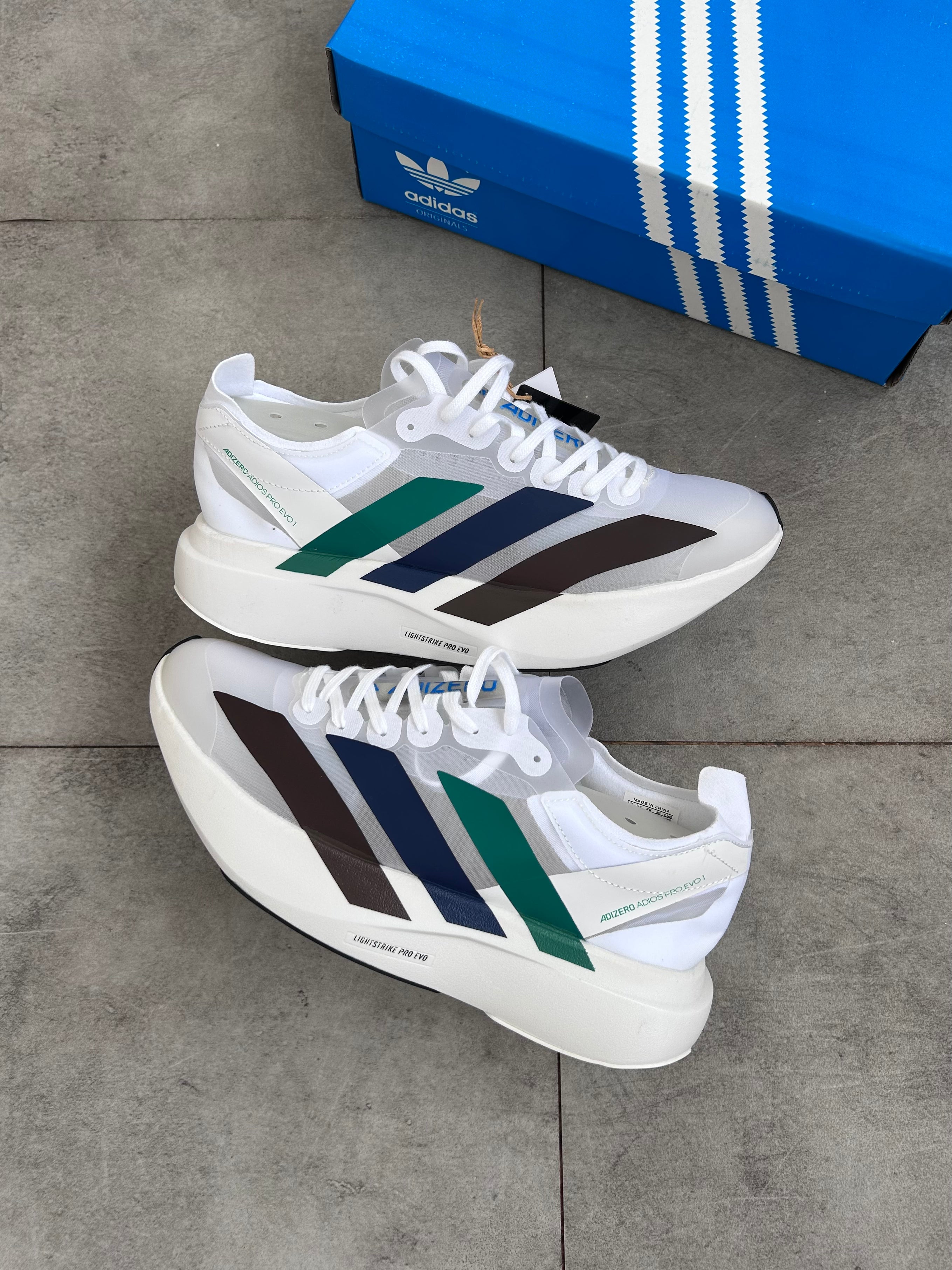 Adidas Adizero Adios Pro 4 – Cloud White / Green Spark / Blue / Dark Brown