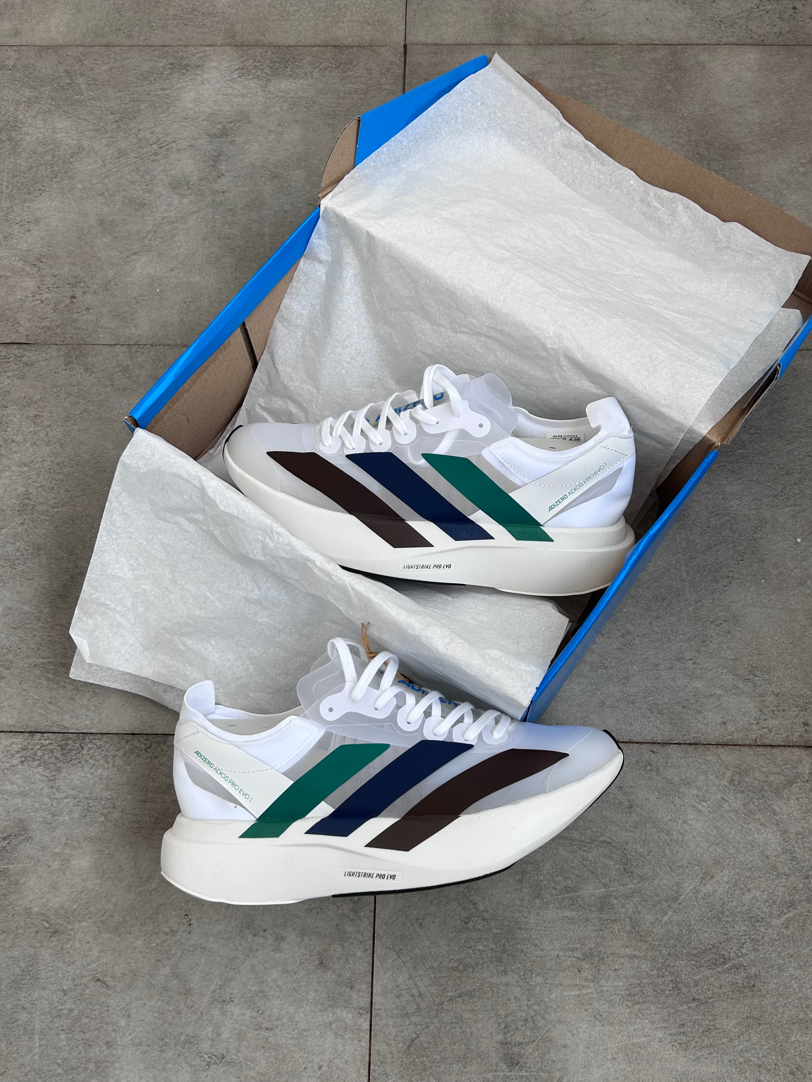 Adidas Adizero Adios Pro 4 – Cloud White / Green Spark / Blue / Dark Brown