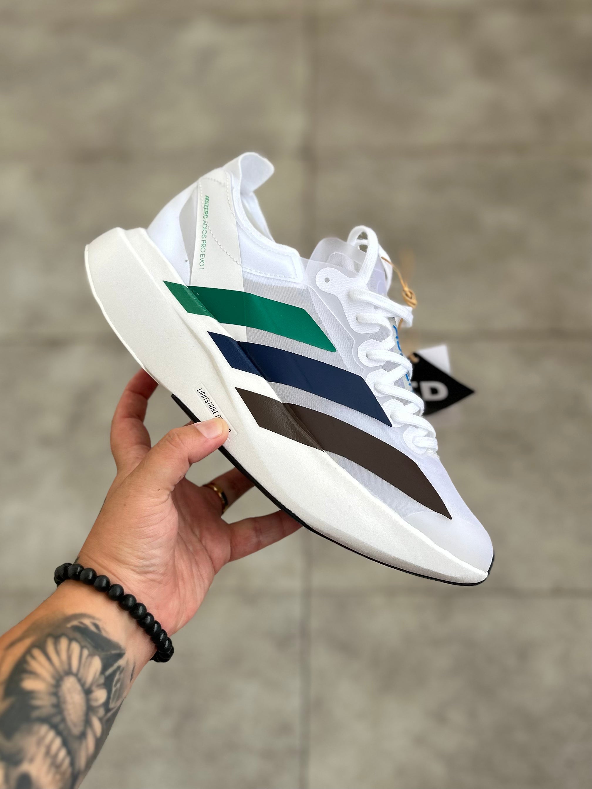 Adidas Adizero Adios Pro 4 – Cloud White / Green Spark / Blue / Dark Brown