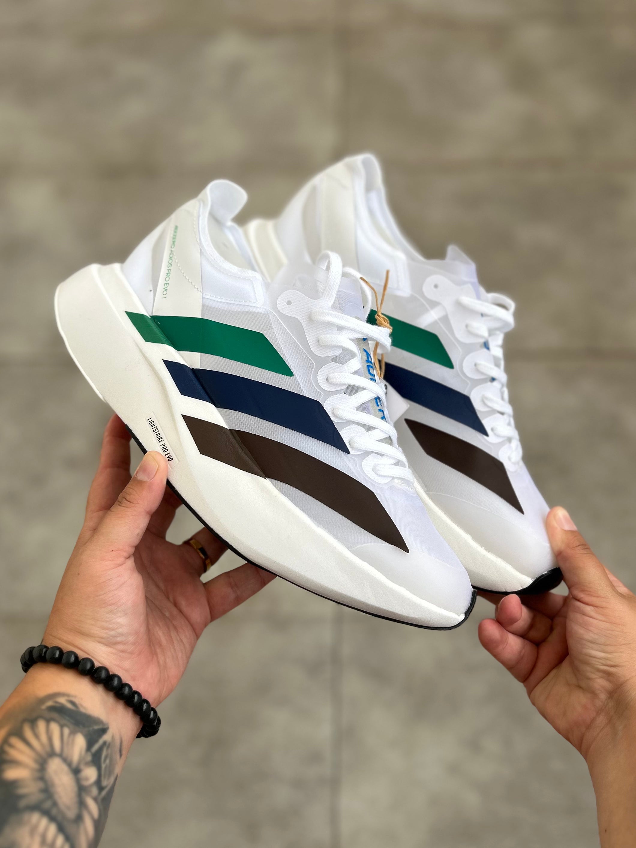 Adidas Adizero Adios Pro 4 – Cloud White / Green Spark / Blue / Dark Brown